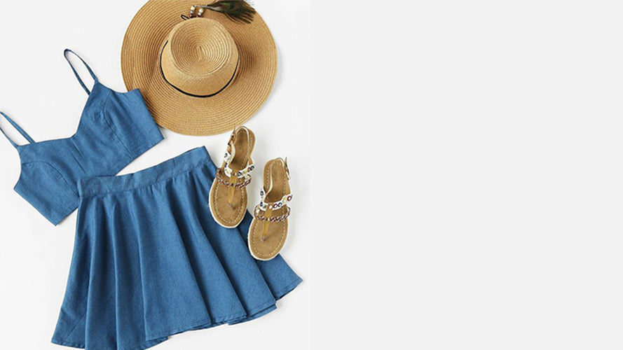 Blue dress with matching sandals and a hat on a white background
